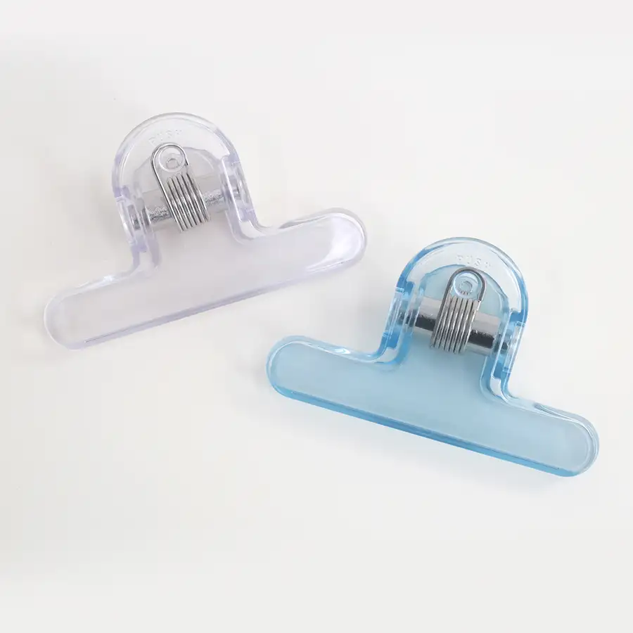 Clear Omo Clip Book Stopper — 2